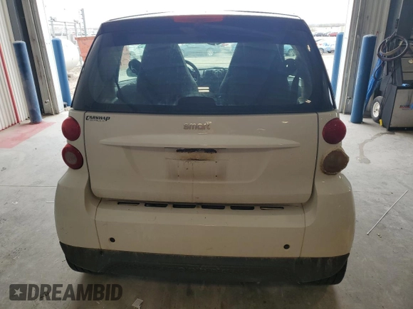 2013 Smart fortwo Pure с VIN WMEEJ3BA9DK626037, выставлен на аукционе Copart как лот 54573255 с пробегом 66 070 миль миль и Чистый • Clean title. История ставок и продаж доступна на DreamBid. Изображение 6.