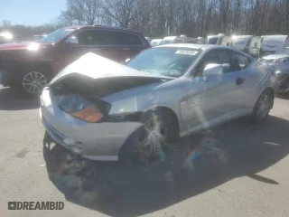 2003 Hyundai Tiburon GS with VIN KMHHM65D03U056017, listed as a Copart auction lot 49678695 with 99,729 mi miles and Salvage Title. Bid and sale history available at carsss.com. Image 1.