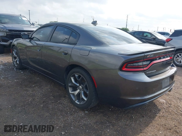 2015 Dodge Charger SXT with VIN 2C3CDXHG7FH886502, listed as a IAAI auction lot 42072027 with 105,034 mi miles and . Bid and sale history available at DreamBid. Image 3.