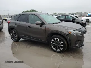 2016 Mazda CX-5 Grand Touring with VIN JM3KE2DY4G0811386, listed as a Copart auction lot 51961795 with 99,525 mi miles and Salvage Title. Bid and sale history available at carsss.com. Image 4.