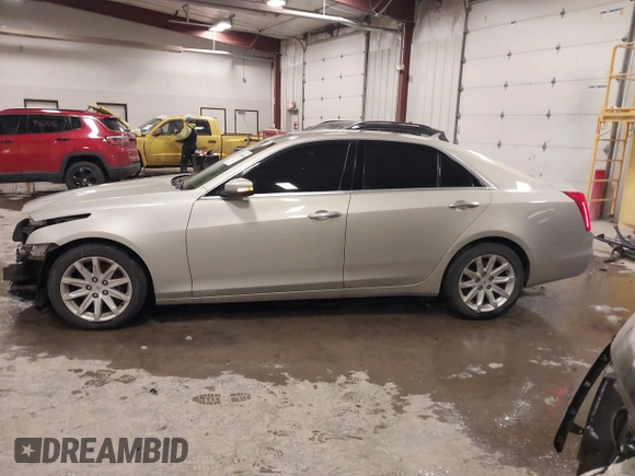 2014 Cadillac CTS Luxury AWD with VIN 1G6AX5S3XE0197628, listed as a IAAI auction lot 41400988 with 144,026 mi miles and . Bid and sale history available at DreamBid. Image 14.
