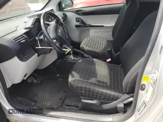 2012 Scion iQ with VIN JTNJJXB03CJ015321, listed as a Copart auction lot 54332355 with 63,439 mi miles and Salvage title. Bid and sale history available at DreamBid. Image 7.