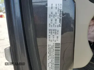 2015 Dodge Grand Caravan American Value with VIN 2C4RDGBG6FR603659, listed as a Copart auction lot 52385735 with 209,818 mi miles and Salvage Title. Bid and sale history available at DreamBid. Image 13.