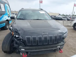 2019 Jeep Cherokee Trailhawk with VIN 1C4PJMBX6KD232515, listed as a IAAI auction lot 39495367 with 53,293 mi miles and . Bid and sale history available at DreamBid. Image 13.