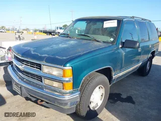 1997 Chevrolet Tahoe with VIN 1GNEK13RXVJ375189, listed as a IAAI auction lot 41959601 with 153,589 mi miles. Bid and sale history available at carsss.com. Image 2.