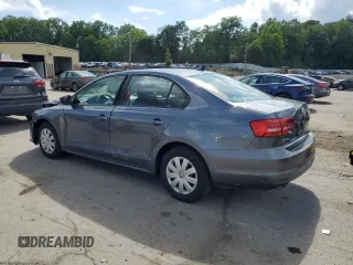 2015 Volkswagen Jetta S with VIN 3VW2K7AJ5FM327788, listed as a Copart auction lot 64034985 with 43,172 mi miles and Salvage title. Bid and sale history available at DreamBid. Image 2.