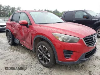2016 Mazda CX-5 Grand Touring z VIN JM3KE2DY8G0623423, wystawiony jako Copart lot #58599545 z przebiegiem 131 932 mil mil oraz Szkoda całkowita • Salvage title. Historia ofert i sprzedaży dostępna na DreamBid. Obrazek 4.