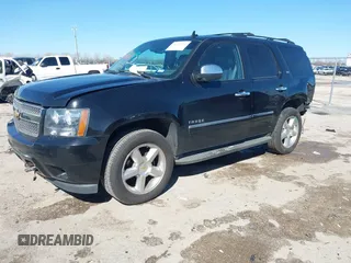 2013 Chevrolet Tahoe LTZ with VIN 1GNSKCE0XDR350970, listed as a IAAI auction lot 41704253 with 126,653 mi miles and . Bid and sale history available at DreamBid. Image 2.
