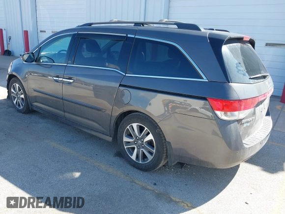 2014 Honda Odyssey Touring with VIN 5FNRL5H97EB101169, listed as a IAAI auction lot 41869233 with 142,147 mi miles and . Bid and sale history available at DreamBid. Image 3.