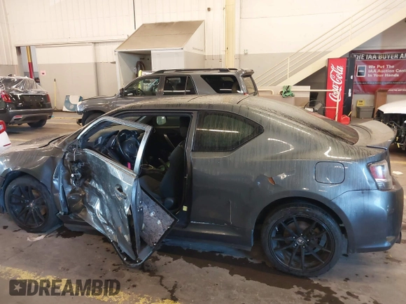 2014 Scion tC with VIN JTKJF5C77E3069906, listed as a IAAI auction lot 41243445 with 128,791 mi miles. Bid and sale history available at carsss.com. Image 14.
