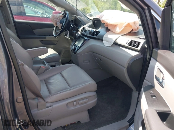 2014 Honda Odyssey EX-L with VIN 5FNRL5H60EB117218, listed as a IAAI auction lot 42201739 with 184,586 mi miles and . Bid and sale history available at DreamBid. Image 5.