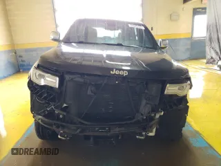 2015 Jeep Grand Cherokee Overland with VIN 1C4RJFCG8FC653117, listed as a Copart auction lot 49254595 with 142,359 mi miles and Clean Title. Bid and sale history available at carsss.com. Image 5.