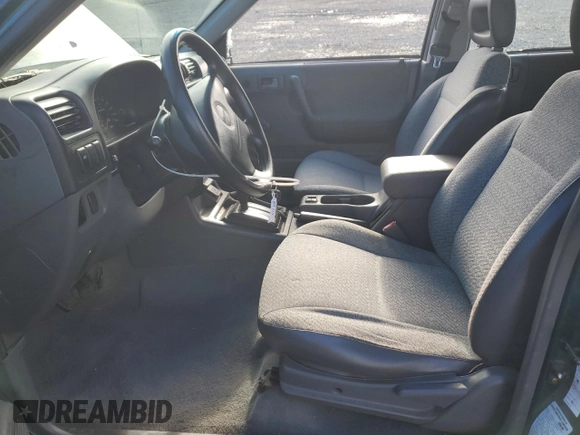 1999 Isuzu Rodeo S with VIN 4S2CM58W7X4359649, listed as a Copart auction lot 83450174 with 171,940 mi miles and Salvage title. Bid and sale history available at DreamBid. Image 7.
