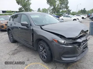 2018 Mazda CX-5 Touring z VIN JM3KFACM6J0420804, wystawiony jako IAAI lot #42344855 z przebiegiem 125 462 mil mil oraz . Historia ofert i sprzedaży dostępna na DreamBid. Obrazek 1.