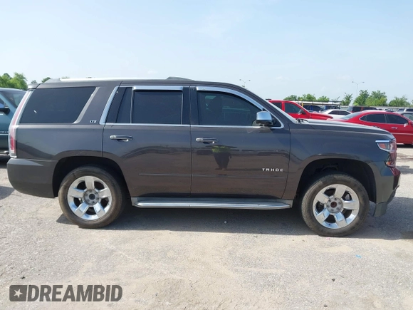 2015 Chevrolet Tahoe LTZ with VIN 1GNSCCKC2FR170090, listed as a IAAI auction lot 42616452 with 249,940 mi miles and . Bid and sale history available at DreamBid. Image 13.