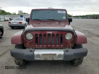 2008 Jeep Wrangler Unlimited Sahara z VIN 1J8GA59108L648333, wystawiony jako Copart lot #57430015 z przebiegiem 506 770 mil mil oraz Czysty tytuł • Clean title. Historia ofert i sprzedaży dostępna na DreamBid. Obrazek 5.