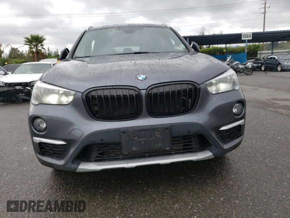 2018 BMW X1 xDrive28i with VIN WBXHT3C33J5K23187, listed as a Copart auction lot 71063192 with 97,403 mi miles. Bid and sale history available at carsss.com. Image 5.
