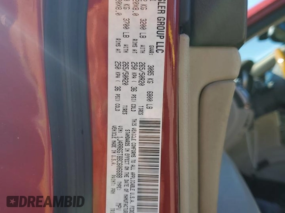 2011 Jeep Grand Cherokee Overland with VIN 1J4RR6GT8BC606688, listed as a Copart auction lot 57182295 with 100,423 mi miles and Salvage title. Bid and sale history available at DreamBid. Image 13.