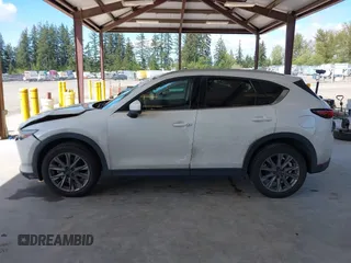 2020 Mazda CX-5 Grand Touring with VIN JM3KFBDM2L0863944, listed as a IAAI auction lot 42150805 with 63,932 mi miles and . Bid and sale history available at DreamBid. Image 14.