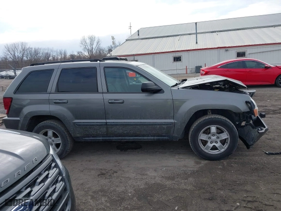 2007 Jeep Grand Cherokee Laredo with VIN 1J8GR48K57C556517, listed as a IAAI auction lot 41534166 with 158,914 mi miles. Bid and sale history available at carsss.com. Image 13.