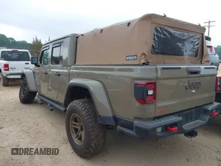 2020 Jeep Gladiator Rubicon z VIN 1C6JJTBG6LL179541, wystawiony jako IAAI lot #42050510 z przebiegiem 52 784 mil mil oraz . Historia ofert i sprzedaży dostępna na DreamBid. Obrazek 3.