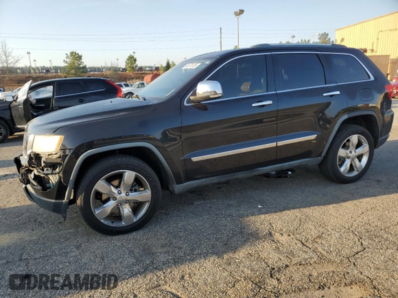 2011 Jeep Grand Cherokee Overland with VIN 1J4RS6GT5BC648076, listed as a Copart auction lot 48878135 with 223,263 mi miles and Salvage Title. Bid and sale history available at DreamBid. Image 1.