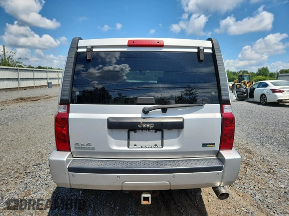 2007 Jeep Commander Sport z VIN 1J8HG48P47C691235, wystawiony jako Copart lot #64057505 z przebiegiem 135 641 mil mil oraz Szkoda całkowita • Salvage title. Historia ofert i sprzedaży dostępna na DreamBid. Obrazek 6.