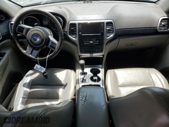 2011 Jeep Grand Cherokee Laredo with VIN 1J4RR4GG6BC538074, listed as a Copart auction lot 60231465 with 203,942 mi miles and Salvage title. Bid and sale history available at DreamBid. Image 8.