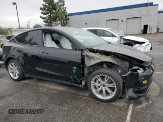 2021 Tesla Model Y Long Range with VIN 5YJYGDEEXMF294556, listed as a Copart auction lot 46668035 with 42,772 mi miles and Salvage Title. Bid and sale history available at DreamBid. Image 4.