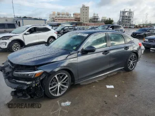 2023 Honda Civic Touring with VIN 2HGFE1F91PH324900, listed as a Copart auction lot 65426915 with Not provided miles and Salvage title. Bid and sale history available at DreamBid. Image 1.