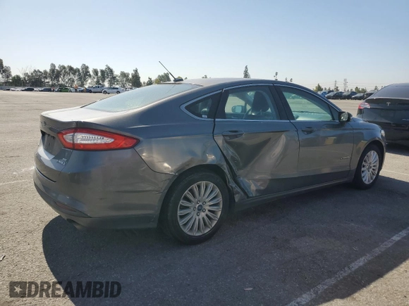 2013 Ford Fusion SE Hybrid z VIN 3FA6P0LU0DR274279, wystawiony jako Copart lot #57462315 z przebiegiem 272 825 mil mil oraz Szkoda całkowita • Salvage title. Historia ofert i sprzedaży dostępna na DreamBid. Obrazek 3.