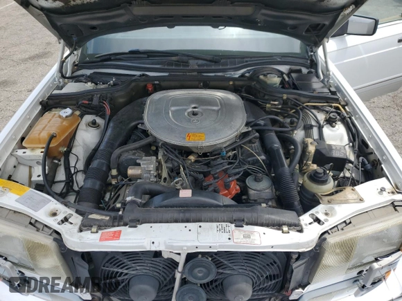 1990 Mercedes-Benz 560 z VIN WDBCA39E7LA505105, wystawiony jako Copart lot #58875015 z przebiegiem 88 261 mil mil oraz Szkoda całkowita • Salvage title. Historia ofert i sprzedaży dostępna na DreamBid. Obrazek 11.
