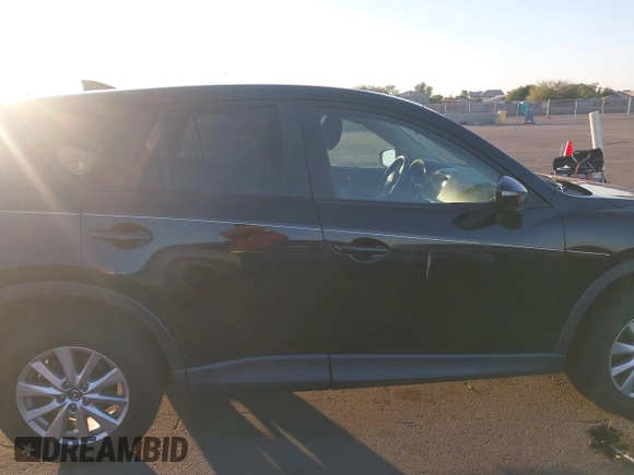 2016 Mazda CX-5 Touring with VIN JM3KE2CY5G0704574, listed as a IAAI auction lot 41033546 with 133,502 mi miles. Bid and sale history available at carsss.com. Image 13.
