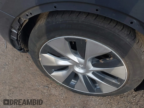 2023 Tesla Model Y Long Range with VIN 7SAYGAEEXPF612231, listed as a IAAI auction lot 41758243 with 32,924 mi miles and . Bid and sale history available at DreamBid. Image 12.
