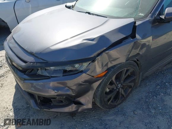 2019 Honda Civic Sport with VIN 2HGFC2F8XKH598141, listed as a IAAI auction lot 42013724 with 98,401 mi miles and . Bid and sale history available at DreamBid. Image 6.