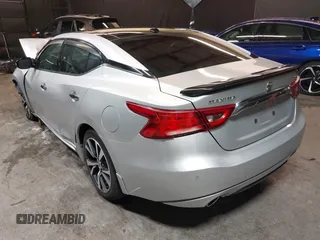 2016 Nissan Maxima SV z VIN 1N4AA6AP4GC415952, wystawiony jako IAAI lot #41806306 z przebiegiem 131 612 mil mil oraz . Historia ofert i sprzedaży dostępna na DreamBid. Obrazek 3.