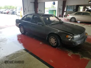 1990 Nissan Maxima с VIN JN1HJ01P3LT420451, выставлен на аукционе Copart как лот 60822275 с пробегом 146 196 миль миль и Списание • Salvage title. История ставок и продаж доступна на DreamBid. Изображение 4.