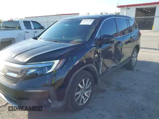 2021 Honda Pilot EX-L with VIN 5FNYF5H55MB044677, listed as a IAAI auction lot 42038704 with 38,684 mi miles and . Bid and sale history available at carsss.com. Image 6.