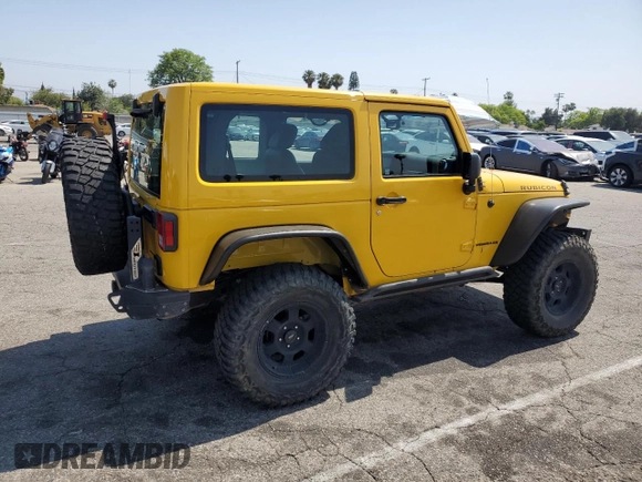 2015 Jeep Wrangler Rubicon Hard Rock with VIN 1C4BJWCG6FL568665, listed as a Copart auction lot 60282155 with 107,773 mi miles and Salvage title. Bid and sale history available at DreamBid. Image 3.