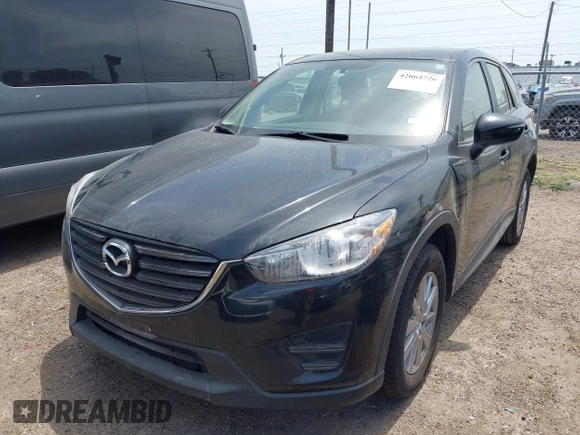2016 Mazda CX-5 Sport with VIN JM3KE2BY8G0847018, listed as a IAAI auction lot 42064726 with 69,017 mi miles and . Bid and sale history available at DreamBid. Image 2.