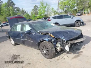 2006 Cadillac DTS 1SB z VIN 1G6KD57Y56U221359, wystawiony jako IAAI lot #42049935 z przebiegiem Nie podano mil oraz . Historia ofert i sprzedaży dostępna na DreamBid. Obrazek 1.