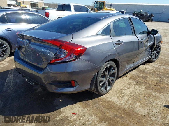 2019 Honda Civic Sport with VIN 19XFC2F82KE019704, listed as a IAAI auction lot 41770051 with 90,011 mi miles and . Bid and sale history available at DreamBid. Image 4.