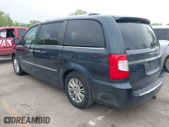 2014 Chrysler Town & Country Limited with VIN 2C4RC1GG3ER188114, listed as a IAAI auction lot 42082618 with 193,562 mi miles and . Bid and sale history available at DreamBid. Image 3.