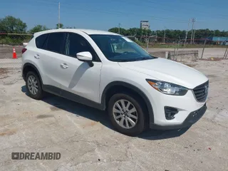 2016 Mazda CX-5 Touring with VIN JM3KE4CY1G0914990, listed as a IAAI auction lot 42030264 with 147,578 mi miles. Bid and sale history available at carsss.com. Image 1.