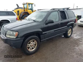 2004 Jeep Grand Cherokee Laredo with VIN 1J4GW48S74C390569, listed as a IAAI auction lot 42384503 with 191,530 mi miles and . Bid and sale history available at DreamBid. Image 2.
