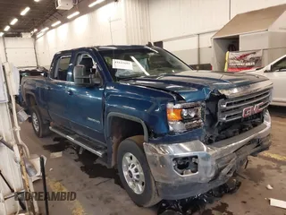 2015 GMC Sierra 2500HD SLE z VIN 1GT12YEG2FF621989, wystawiony jako IAAI lot #41643601 z przebiegiem 207 556 mil mil oraz . Historia ofert i sprzedaży dostępna na DreamBid. Obrazek 1.