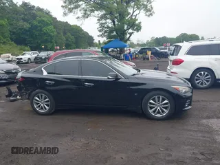 2014 Infiniti Q50 Premium z VIN JN1BV7AR4EM695232, wystawiony jako IAAI lot #42367581 z przebiegiem 138 063 mil mil oraz . Historia ofert i sprzedaży dostępna na DreamBid. Obrazek 13.