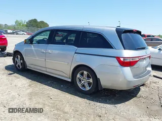 2012 Honda Odyssey Touring with VIN 5FNRL5H96CB043939, listed as a IAAI auction lot 41983643 with 202,535 mi miles. Bid and sale history available at carsss.com. Image 3.