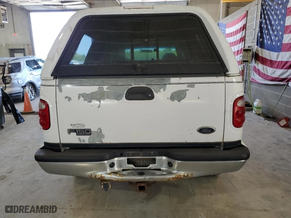 2001 Ford F-150 SuperCrew XLT with VIN 1FTRW08L21KE03150, listed as a Copart auction lot 67372004 with 184,124 mi miles and Salvage Title. Bid and sale history available at carsss.com. Image 6.