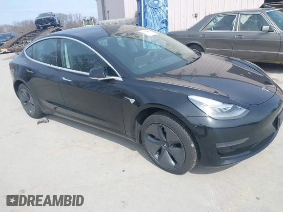 2020 Tesla Model 3 Standard Range Plus with VIN 5YJ3E1EAXLF643807, listed as a IAAI auction lot 41789406 with 49,256 mi miles. Bid and sale history available at carsss.com. Image 1.